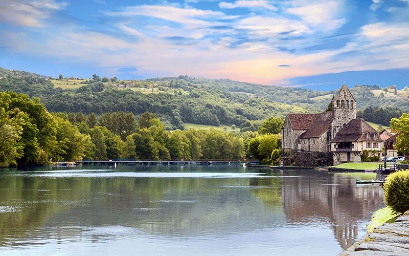 Wooded hills reflected in a lake