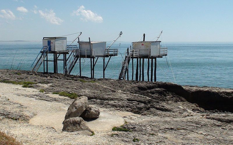 Fishing huts on stilts over the Atlantic